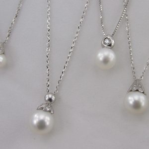 Pendenti in oro bianco 750°°° con diamanti e perle coltivate